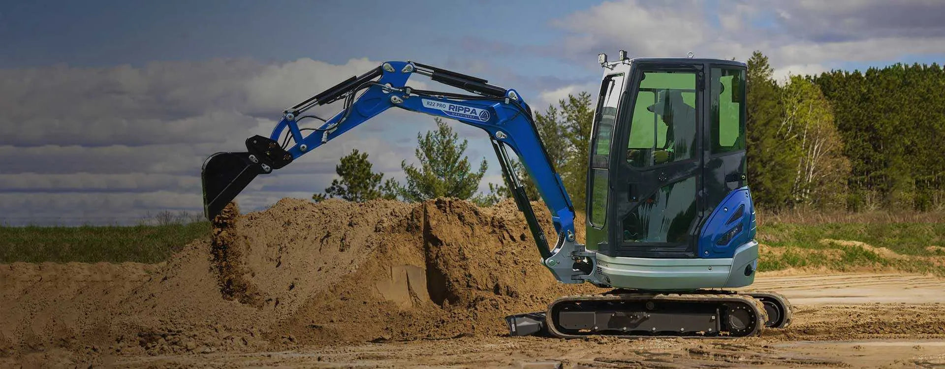 Rippa mini excavator digging on a job site